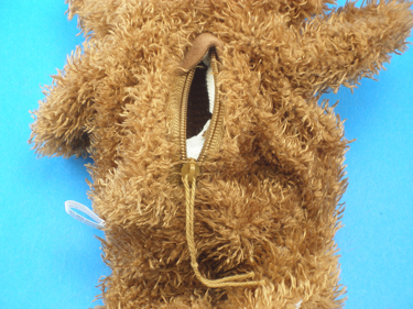 Open zipper located on the back of each bear.